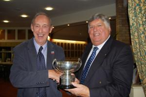Tony Powell, winner of the bowls competition, receiving the trophy from President Ian Birrell